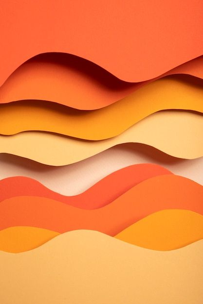 an orange and yellow background with wavy shapes