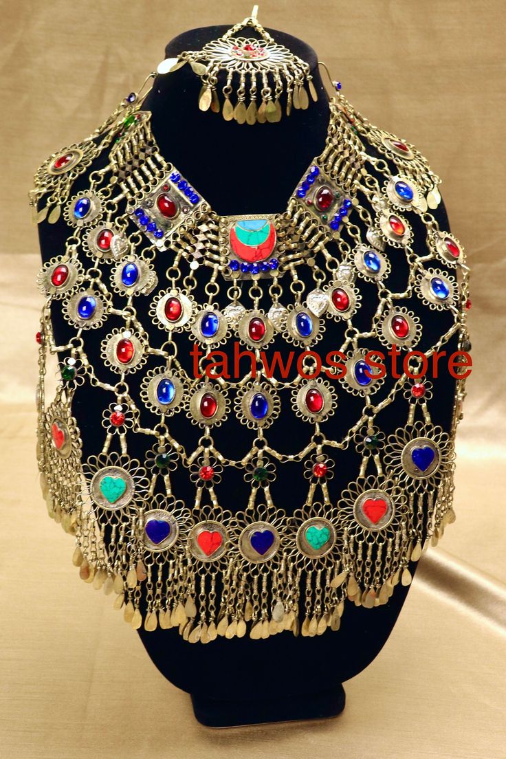 We call this the "Farah Set" - It translates to happiness and Joyful. This is a traditional beautiful jewelry set originated and inspired by classic Afghan fashion. This set contains 4pcs: Necklace, Pair of earrings and a Matika (Headpiece).  Colors: Bronze, Red, Blue, Turquoise and Lapiz Lazuli. Necklace: 10 " drop Earrings:  5 " Matika: 5 " Please note: As this piece is completely handmade, minor discrepancies may be present. These imperfections contribute to making it a unique and one-of-a-ki Multicolor Embellished Festive Jewelry, Traditional Gold Embellished Necklace, Traditional Embellished Gold Necklace, Traditional Embellished Necklaces For Parties, Traditional Embellished Necklace For Party, Traditional Embellished Wedding Necklaces, Traditional Embellished Party Necklace, Red Festival Jewelry, Red Embellished Wedding Jewelry