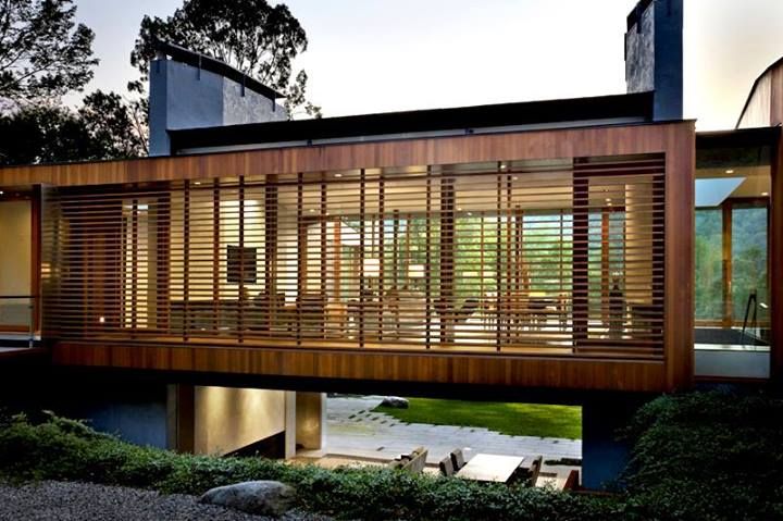 a modern house with wooden slats on the roof