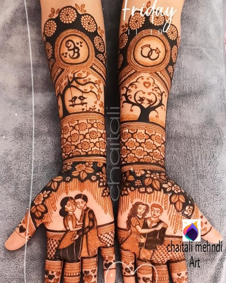 two hands with henna designs on them