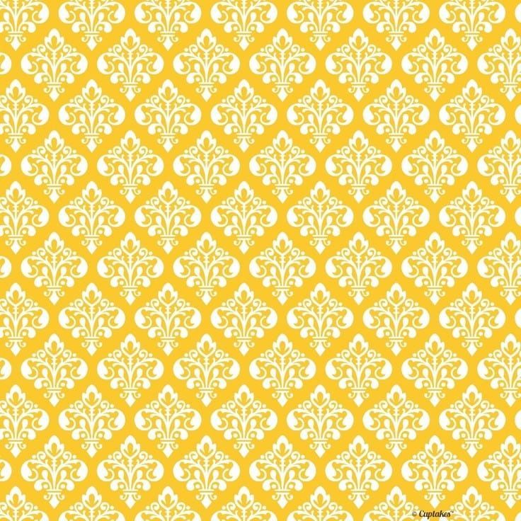 a yellow and white wallpaper with an ornate design