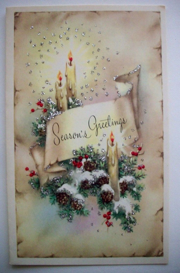 a christmas card with candles, holly and pine cones on the bottom reads season's greetings