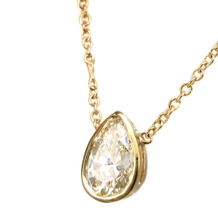 "This framed bezel design pendant complimented with Pear Shape Diamond is hand crafted and cast in solid 14K yellow gold.  Chain is included. COMPONENT DIAMOND: 1 Pear Shape Diamond center CARAT WEIGHT:  0.50ct COLOR/CLARITY: G - H / SI METAL:  14K Yellow Gold  GRAM WEIGHT:  1.5gr WIDTH:  7.6  x 5.3mm DEPTH:  3.0mm  LENGTH: 16\" (including chain) STYLE CODE: NK3612-DIS All of our items are made in the U.S.A. For your other preferences, simply contact us. To see more of my necklaces: https://www. Luxury Pear-shaped Yellow Gold Diamond Necklace, Classic Yellow Gold Pear Shaped Diamond Necklace, Classic Bezel-set Teardrop Pendant Jewelry, Gold Jewelry With Single Pear-shaped Diamond, Gold Pear-shaped Jewelry With Single Diamond, Timeless Teardrop Bezel Set Jewelry, Classic Teardrop Pendant Jewelry With Bezel Setting, Gold Teardrop Jewelry With Bezel Setting, Classic Teardrop Pendant With Bezel Setting