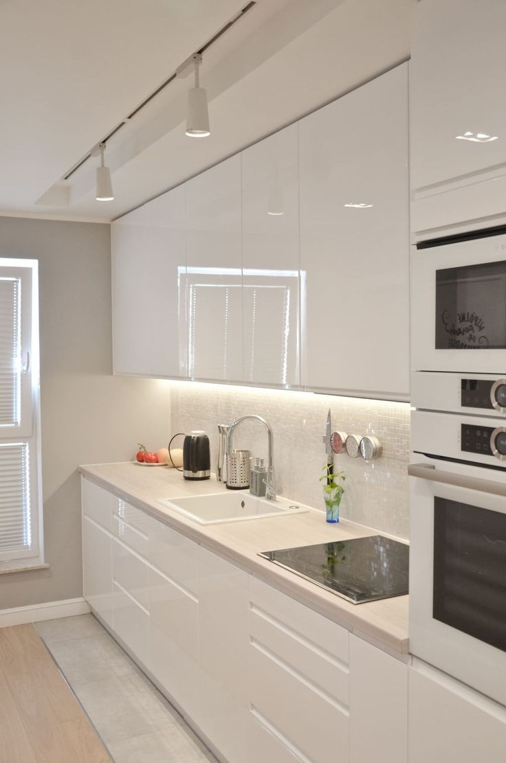 a kitchen with white cabinets and appliances on the counter top is shown in an instagram