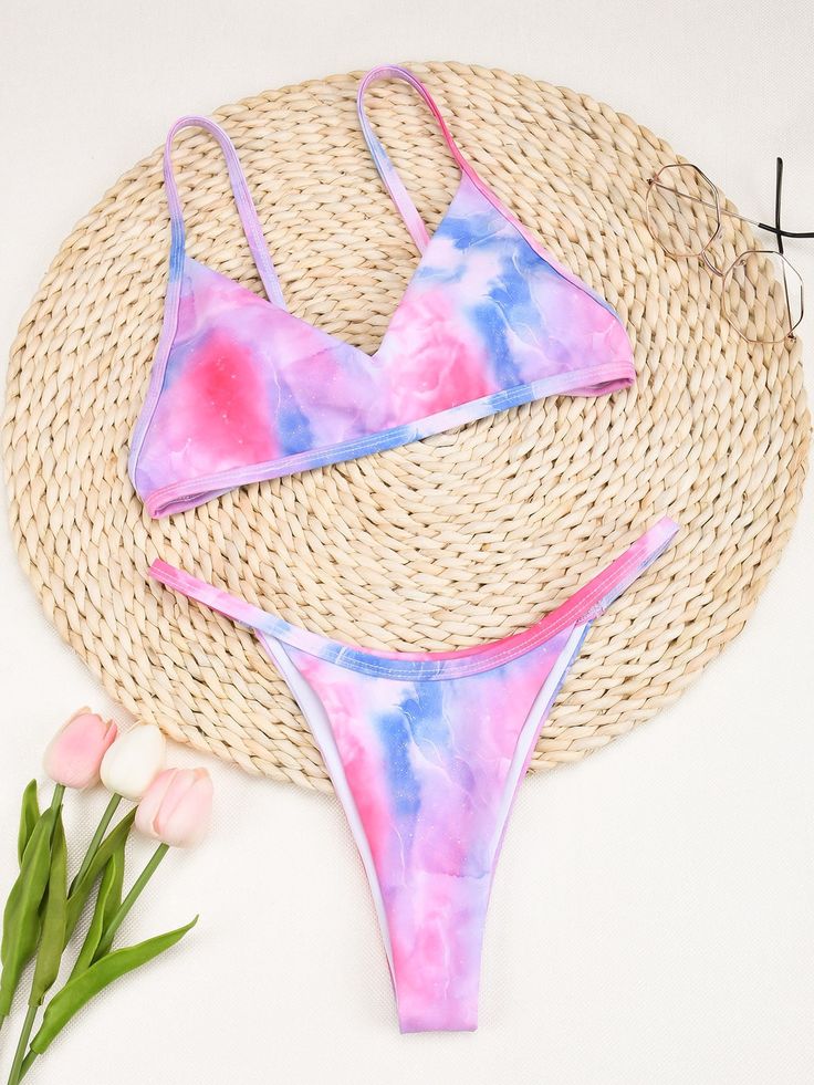 This Brazilian style tie-dyed bikini set will let your grace take the front seat in summer. Made from durable polyester, heat-resistant spandex, and abrasion-resistant nylon, this low-waisted, wire-free bikini set offers the utmost comfort all-day long while giving that sexy feel. This padded bikini set will make every woman's sunbath memorable. SpecificationsBrand Name: GeraldBlackOrigin: CN(Origin)Pattern Type: PrintWaist: Low WaistItem Type: Bikinis SetSupport Type: Wire FreeModel Number: C31 Tie-dye Triangle Top Swimwear, Tie-dye Swimwear For Beach Season, Tie Dye Triangle Top Swimwear For Swimming, Fitted Tie Dye Swimwear For Vacation, Tie-dye Swimwear For Summer Pool, Summer Tie-dye Swimwear For Pool, Tie-dye Swimwear For Sunbathing, Tie Dye Swimwear For Summer Pool Days, Summer Tie Dye Swimwear For Pool