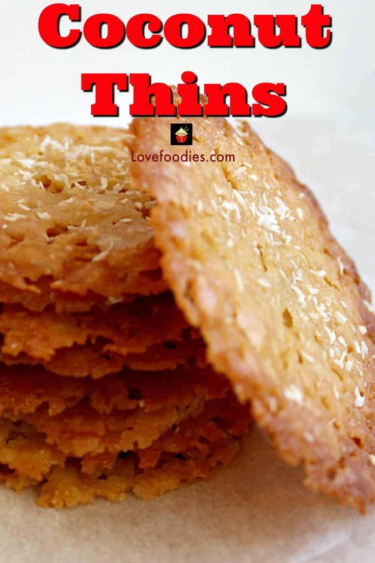 a stack of coconut thins sitting on top of a white tablecloth with the words overlay