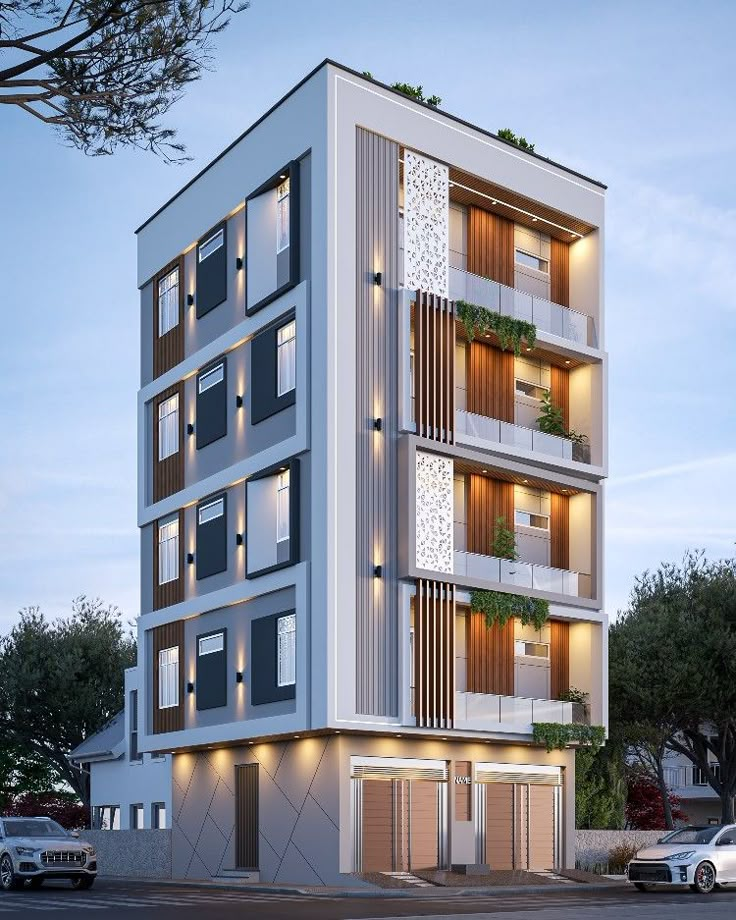 an apartment building with balconies and plants on the top floor is lit up at night