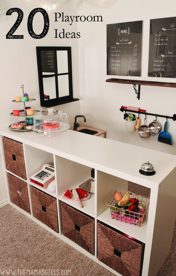 a kitchen with lots of drawers and chalkboard on the wall