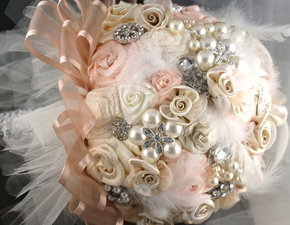 a bridal bouquet with roses and pearls