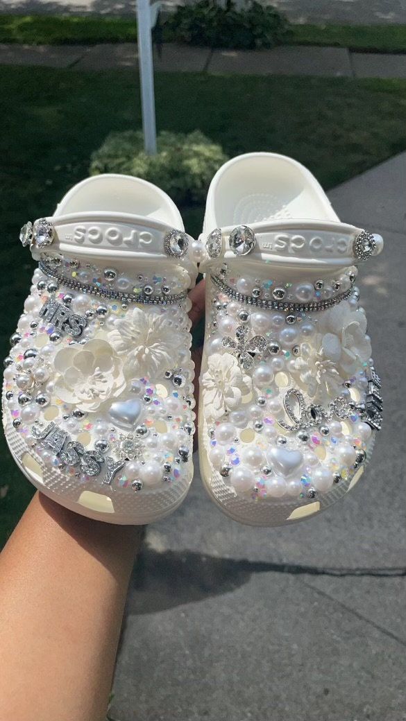 *bridal crocs made for soon to be wife's *crocs will only come in color WHITE. *name changes can be made.. please be specific in personalization box. *please message me for any other questions Pearl Crocs Shoes, Cute Croc Designs, White Bedazzled Crocs, Wedding Crocs For Bride, Bridal Crocs, Baddie Crocs, Customized Crocs Shoes, Blinged Crocs, Croc Designs