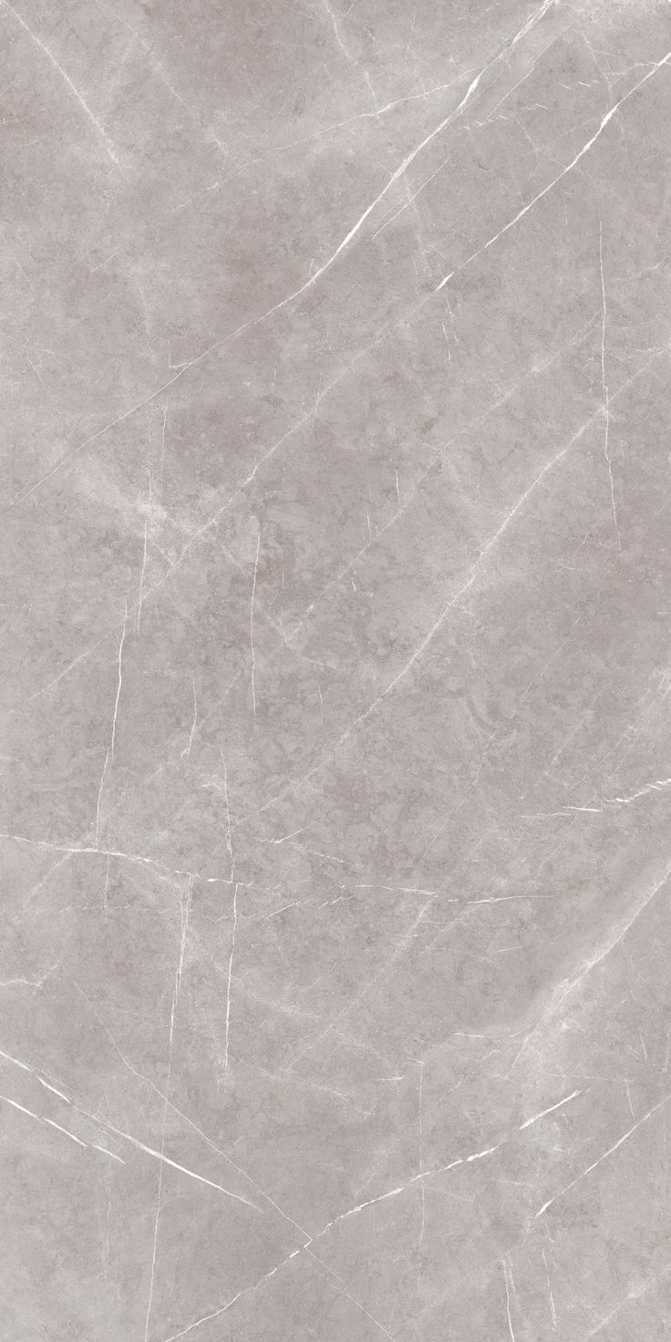 a white marble textured wallpaper with grey vein lines on the bottom and sides