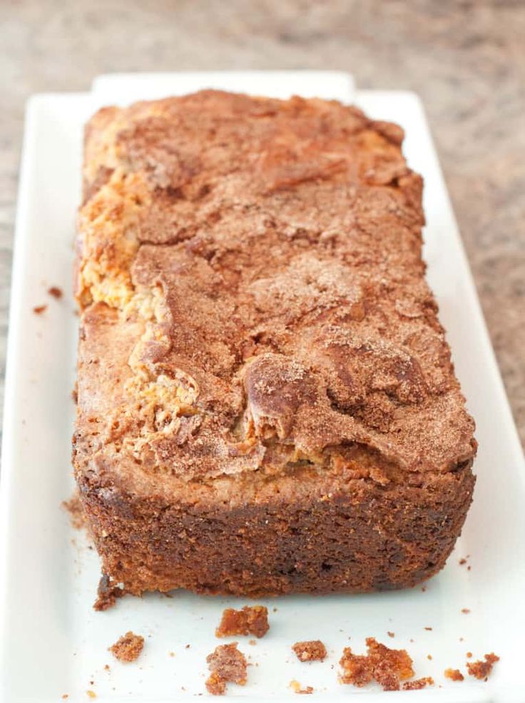 a loaf of bread sitting on top of a white plate