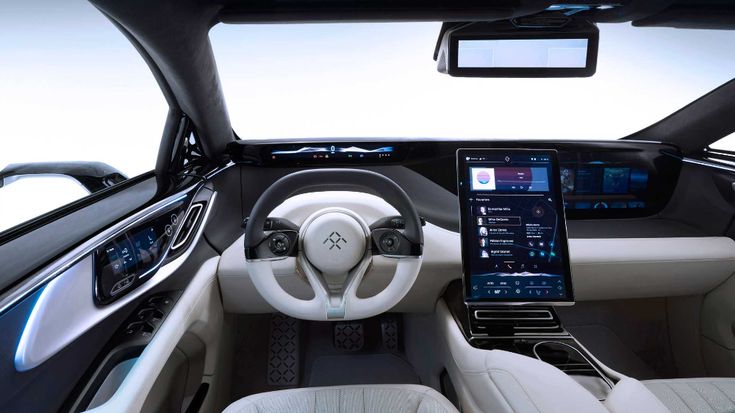 the interior of a car with dashboard, steering wheel and touchscreens on display