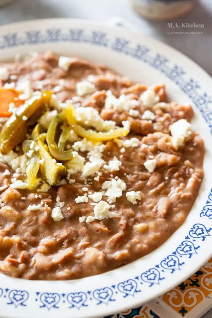 a white plate topped with beans and cheese