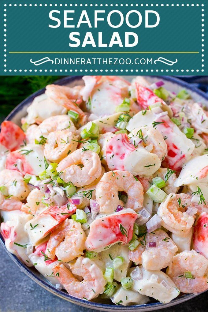 seafood salad with shrimp and celery in a blue bowl on top of a table