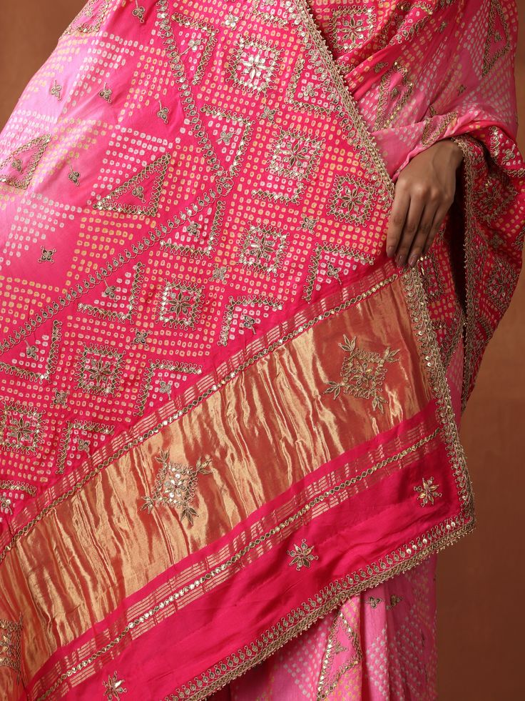 This Bandhani saree with Gotta Patti embroidery is a timeless masterpiece, blending traditional artistry with contemporary elegance. Crafted from pure Gajji silk in a striking red hue, it exudes grace and sophistication. Gotta Patti Dupatta, Gajji Silk Bandhani Saree, Gaji Silk Bandhani Saree, Gajji Silk Dupatta, Gotta Patti, Bandhani Saree, Silk Dupatta, Lehenga, Blending