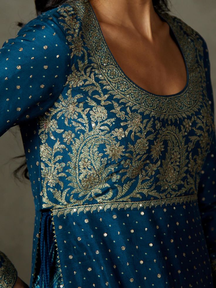 Editor's Note Step into timeless elegance with our midnight blue ari-hand-embroidered ashvika kurta, perfectly paired with garara pants and a coordinating dupatta. This ensemble exudes grace and style, making it an ideal choice for special occasions and events where you want to showcase your classic and sophisticated fashion sense. The intricate embroidery and rich color ensure you make a lasting impression with this timeless attire. Fabric: Silk flat dupion Color: Blue Components: Kurta, garara Festive Blue Sharara With Straight Kurta, Blue Sharara With Straight Kurta For Festive Occasions, Blue Palazzo Set With Intricate Embroidery And Long Sleeves, Blue Palazzo Set With Zari Work For Festive Occasions, Blue Palazzo Set With Intricate Embroidery, Blue Long Sleeve Palazzo Set With Intricate Embroidery, Blue Palazzo Set With Intricate Embroidery For Diwali, Festive Blue Palazzo Set With Chikankari Embroidery, Anarkali Blue Palazzo Set For Reception