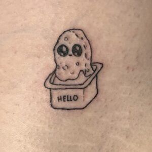 a small tattoo with an ice cream cone in it