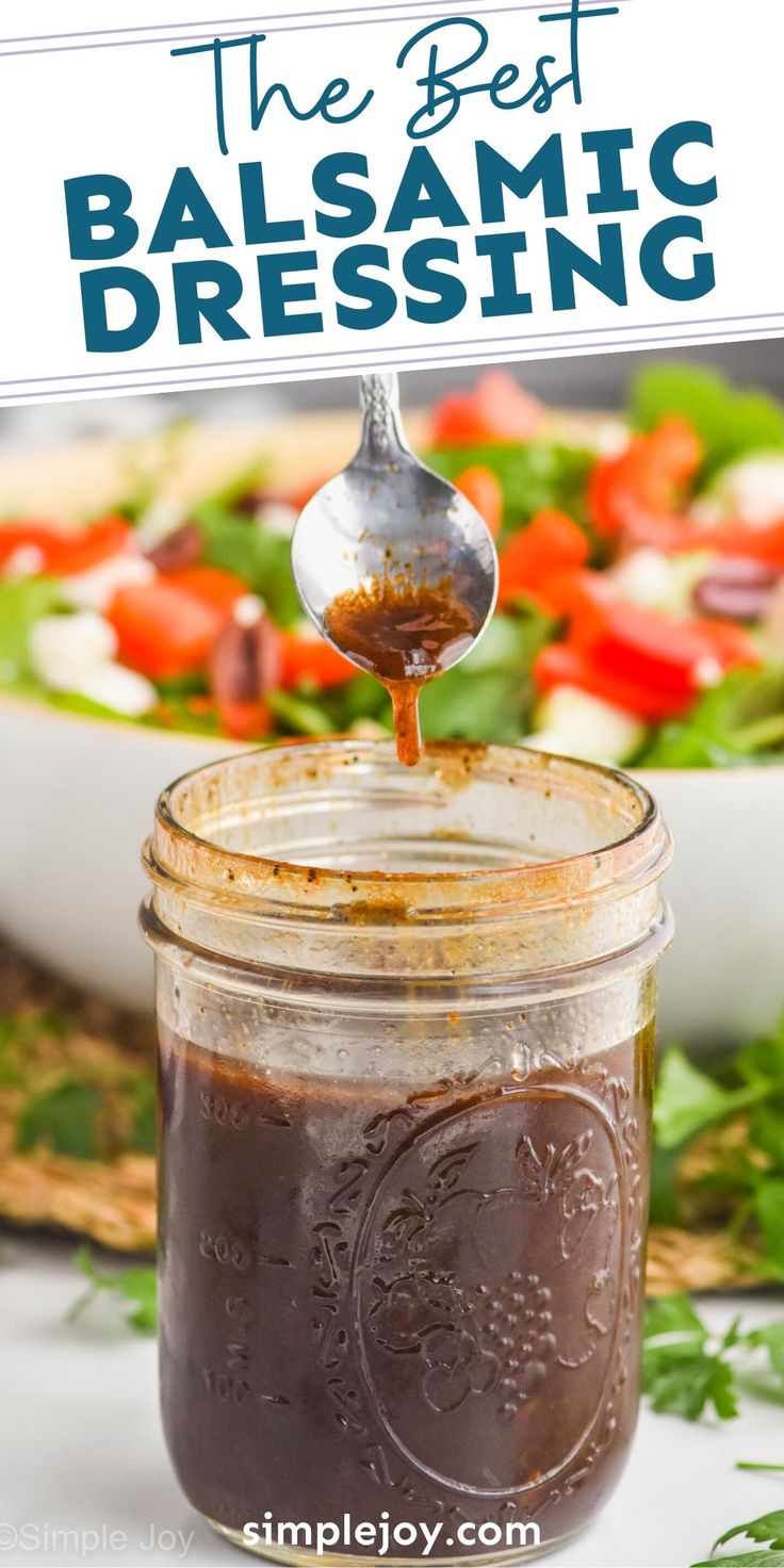 the best balsamic dressing in a mason jar with a spoon sticking out of it