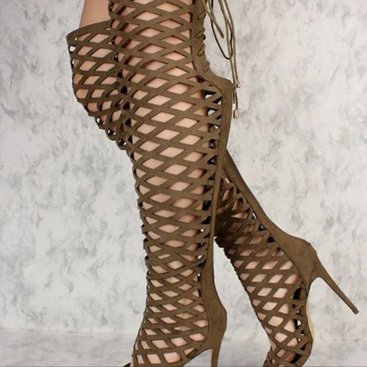 Vince Camuto's Keliana Gladiator Stilettos With An Eye-Catching, Over-The Knee Silhouette And Striking Caged Design. Round Peep-Toe Over-The-Knee Gladiator Sandals. Zipper And Tie Closure At Back; Caged Design. Shaft: 23-1/2" Height, 14" Circumference. 4" Wrapped Stiletto Heel. Please Note: Shaft Height And Circumference Will Vary By Size. Leather Upper; Manmade Sole.Vince Camuto's Keliana Gladiator Stilettos With An Eye-Catching, Over-The Knee Silhouette And Striking Caged Design. Round Peep-To Fitted Brown Closed Toe Sandals, Spring Knee-high Heeled Boots With Stacked Heel, Knee-high Leather Heels With Stacked Heel, Elegant Brown Knee-high Boots With Stacked Heel, Thigh High Gladiator Heels, Brown Gladiator Sandals, Gladiator Boots, Vince Camuto Shoes, Gladiator Sandals