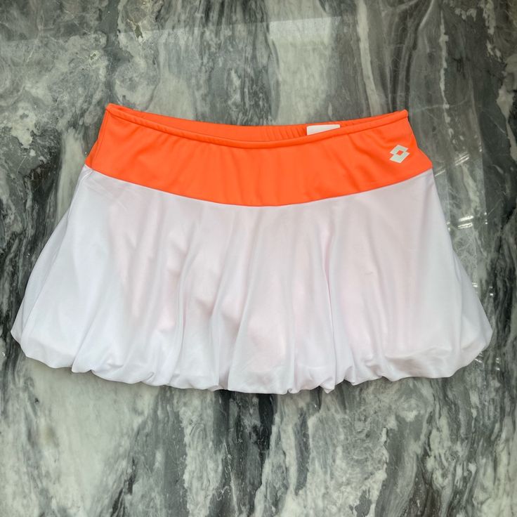 Brand: Lotto Size: Xs Color: White With Orange Waistband And Orange Built-In Shorts Details: Built-In Shorts Bubble Hem Italian Sport Design Style Code: Q8632 Rn 131902 Excellent Condition (Never Worn) White Sporty Tennis Skirt For Summer, White Stretch Tennis Skirt For Summer, White Sporty Skirt, White Tennis Skirt With Elastic Waistband For Spring, White Tennis Skirt For Beach In Spring, White Tennis Skirt For Spring Beach Occasions, White Lined Skirt Shorts For The Beach, White Stretch Skirt For Vacation, White Mini Swim Skirt For Spring