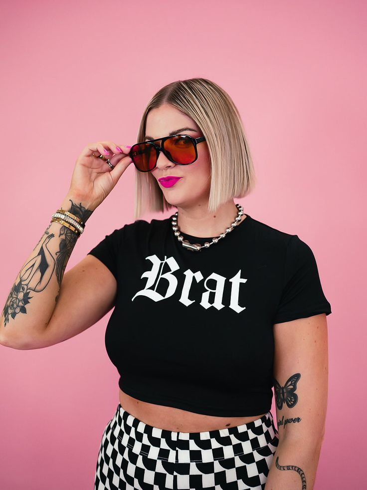 Get ready for the ultimate summer vibes with our It's a Brat Summer Cropped Tee! This edgy and cool top features the total "brat aesthetic" and comes in sizes small to XL! Perfect for anyone looking to add some playful attitude to their wardrobe. -Available in sizes Small-XL -Super soft, cotton fabric with STRETCH -Crop top style -A play on the Charli XCX album "Brat" #iykyk -Veryyyyy on trend -95% Polyester; 5% Elastane SIZING: The tee fits true to size. Alora is 5'8 and 8/10 in jeans wearing a Brat Aesthetic, Brat Summer, Kimono Coat, Checker Print, Charli Xcx, Cropped Tee, Crop Tee, Dress Accessories, Set Dress