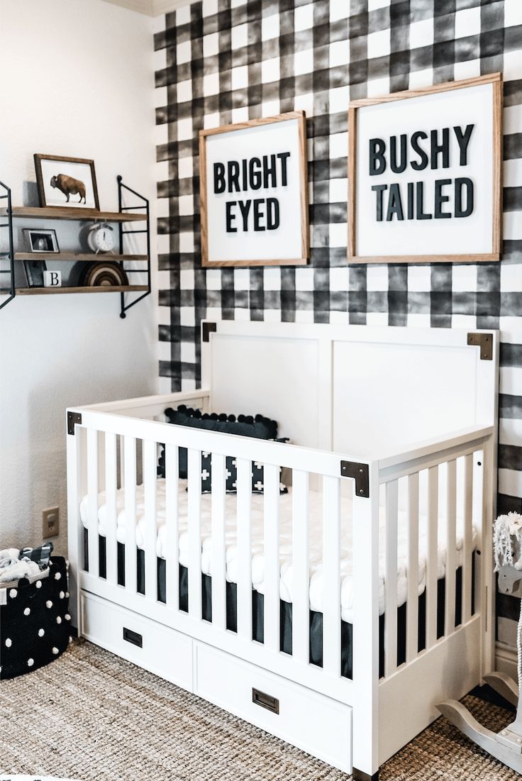 a baby's room decorated in black and white