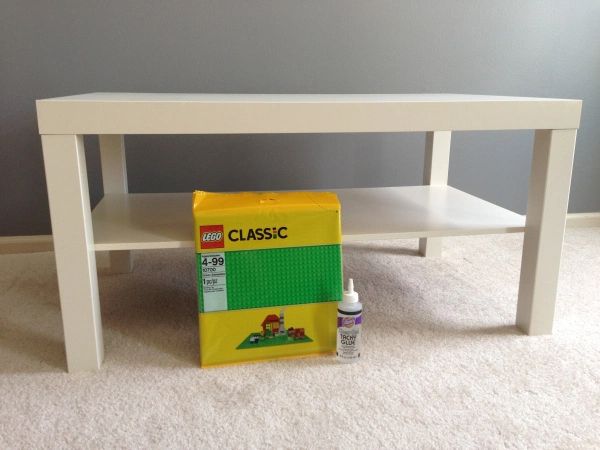 a white table with a yellow box on it and some glue in front of it