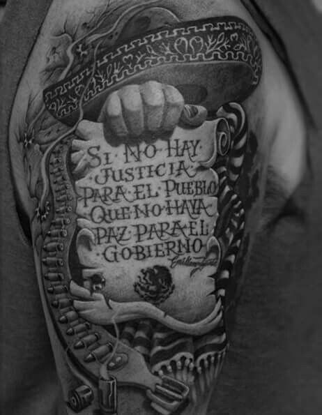 a black and white photo of a man's arm with an old school tattoo on it