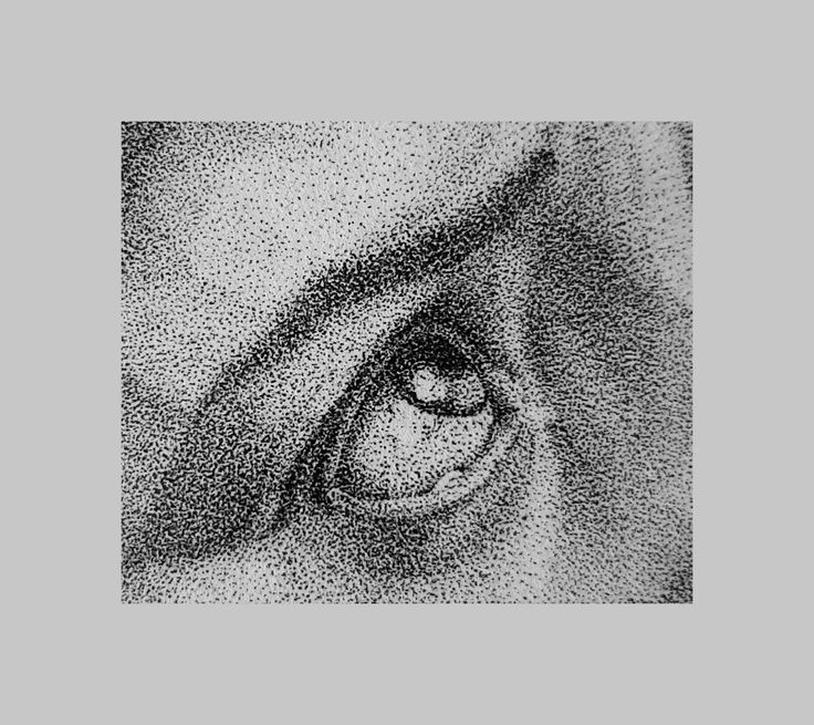 an eye is shown in black and white, with small dots on the iris's side