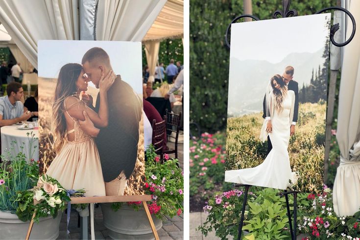 a couple kissing in front of their wedding pictures