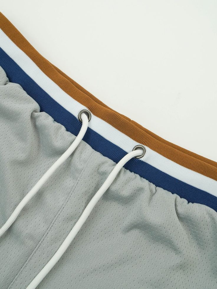 Inspired by the nostalgic era of the 90s, we designed this short to fit right above your knee.The Grey Scale Active Short is made with 4 technical multi-stretch fabrics. Deep pockets on the side. Ribbed waistband with an adjustable drawstring. Inner lining that wicks away moisture and provides ultimate comfort. Above the knee fit Made with 4 multi-stretch fabric (contains spandex) Ribbed Waistband Embroidered Kinetic branding Model 6'0 160lbs wearing a Medium Grey Scale, Mesh Short, Active Shorts, Wicks, The 90s, Above The Knee, On The Side, Medium Size, The Knee