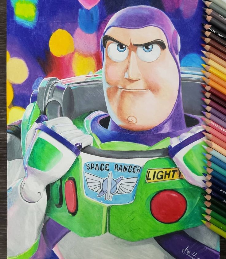 a drawing of buzz lightyear with colored pencils in front of him and the space ranger logo on his chest