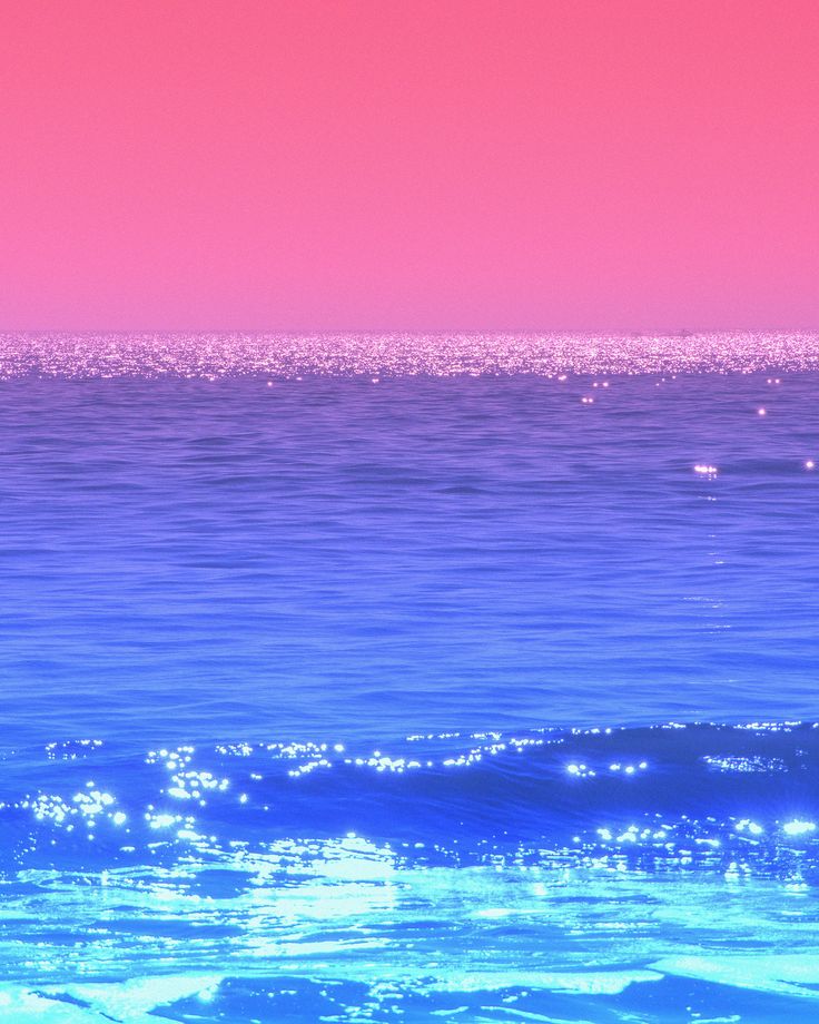 a pink and blue sky over the ocean