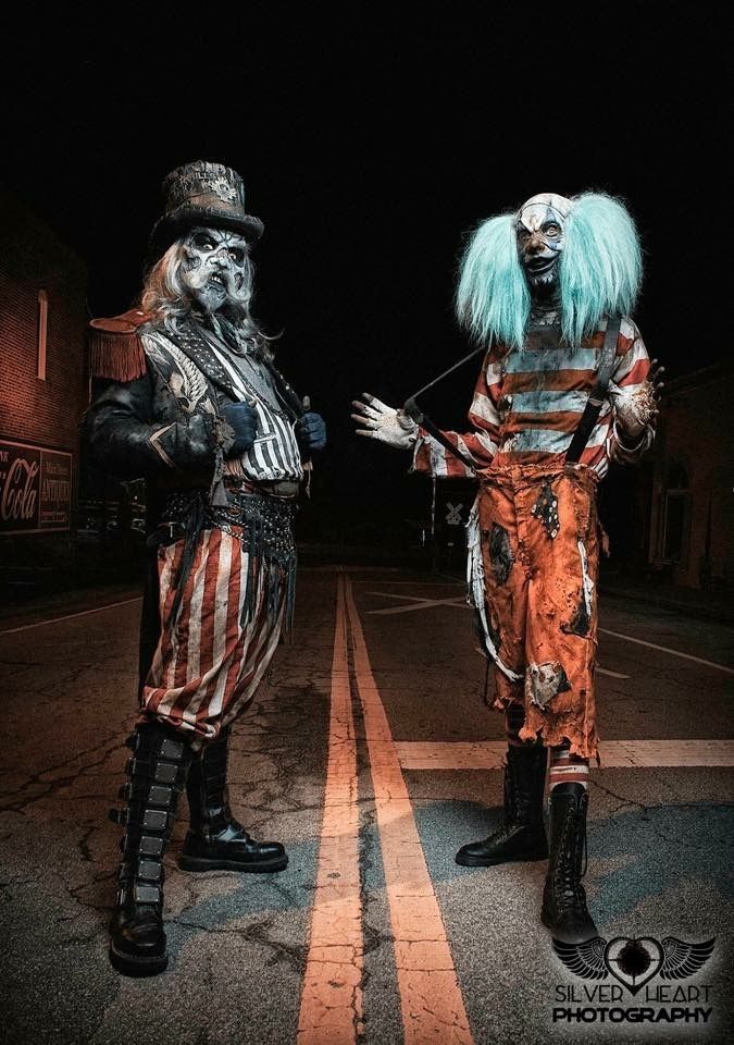 two people dressed in costumes standing next to each other