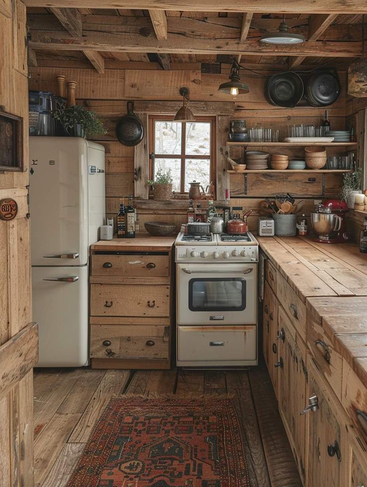 an old fashioned kitchen with wooden walls and flooring