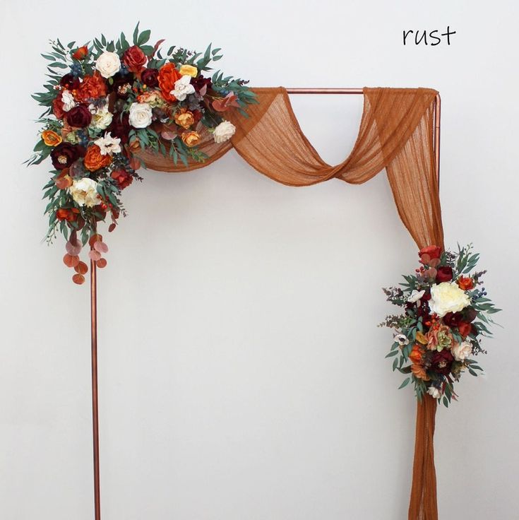 an arch decorated with flowers and greenery for a wedding or reception ceremony is displayed on the wall