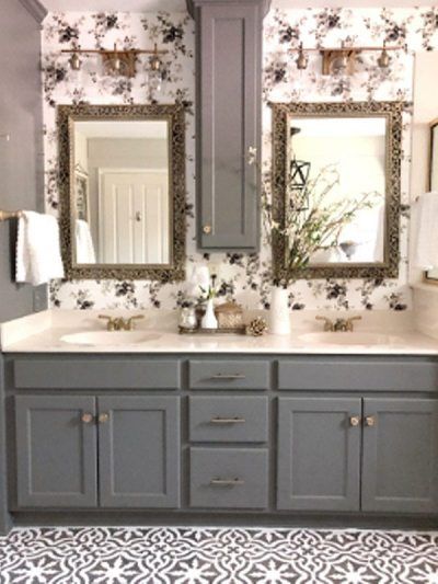 a bathroom with two sinks and mirrors on the wall