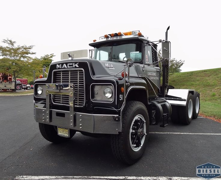 a mack truck parked in a parking lot