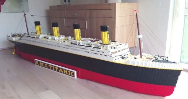 a large model ship sitting on top of a hard wood floor