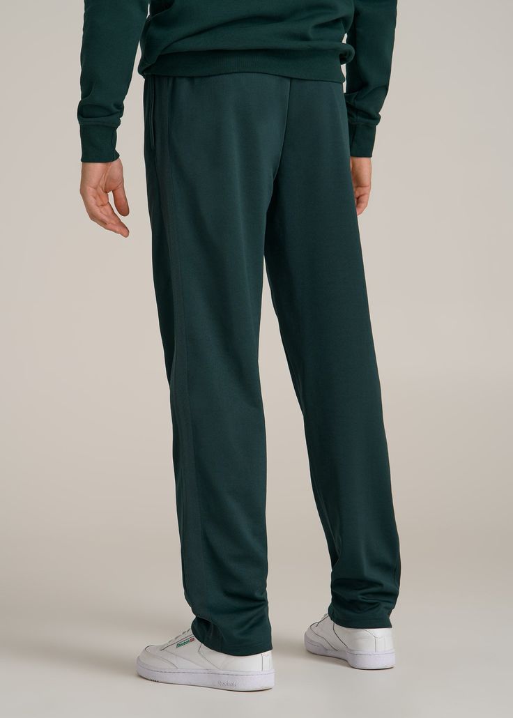 Track Pants Made for the Long-Legged Runner Hit Your Stride For the tall man who never slows down, our Tricot Extra-Long Track Pants are here to keep up. Whether you're sprinting on the track or sprinting through errands, these men's tall active pants offer the stretch and comfort you need to move freely. The mid-rise fit ensures they sit comfortably, while the internal drawstring keeps them secure. Pre-washed to maintain size and quality, these are the athletic pants for tall men you'll reach f Sporty Full-length Green Bottoms, Moisture-wicking Full-length Sweatpants For Loungewear, Green Relaxed Fit Sports Bottoms, Green Athleisure Sweatpants, Sportswear Pants With Elastic Waistband And Straight Hem, Sports Pants With Elastic Waistband, Sports Pants With Ribbed Waistband And Straight Hem, Sportswear Pants With Elastic Waistband, Green Full Length Sportswear Bottoms