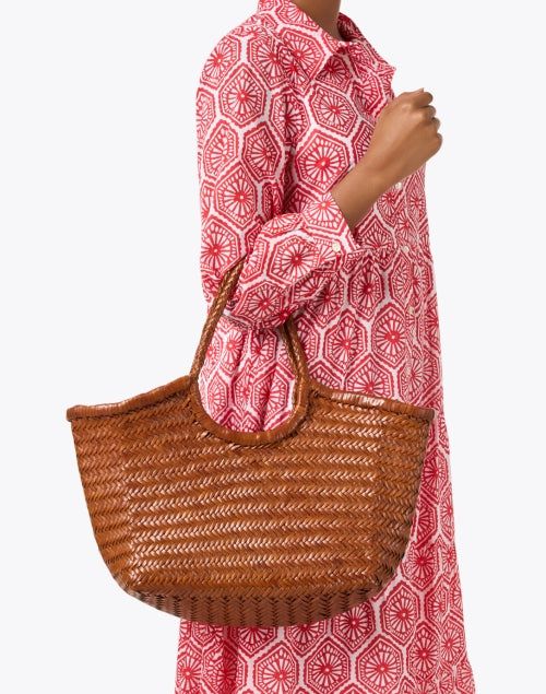 Dragon Diffusion's roomy Nantucket bag is perfect for days by the seaside and city excursions alike. The 100% leather silhouette is handwoven to a roomy basket shape, perfect for toting all of your essentials. Carry it on your shoulder with jeans and a top or use it to tote your travel essentials on your next getaway. Dragon Diffusion, Triple Jump, Woven Leather Bag, Ag Jeans, Printed Shirt Dress, The Seaside, Leather Weaving, Basket Bag, City Prints