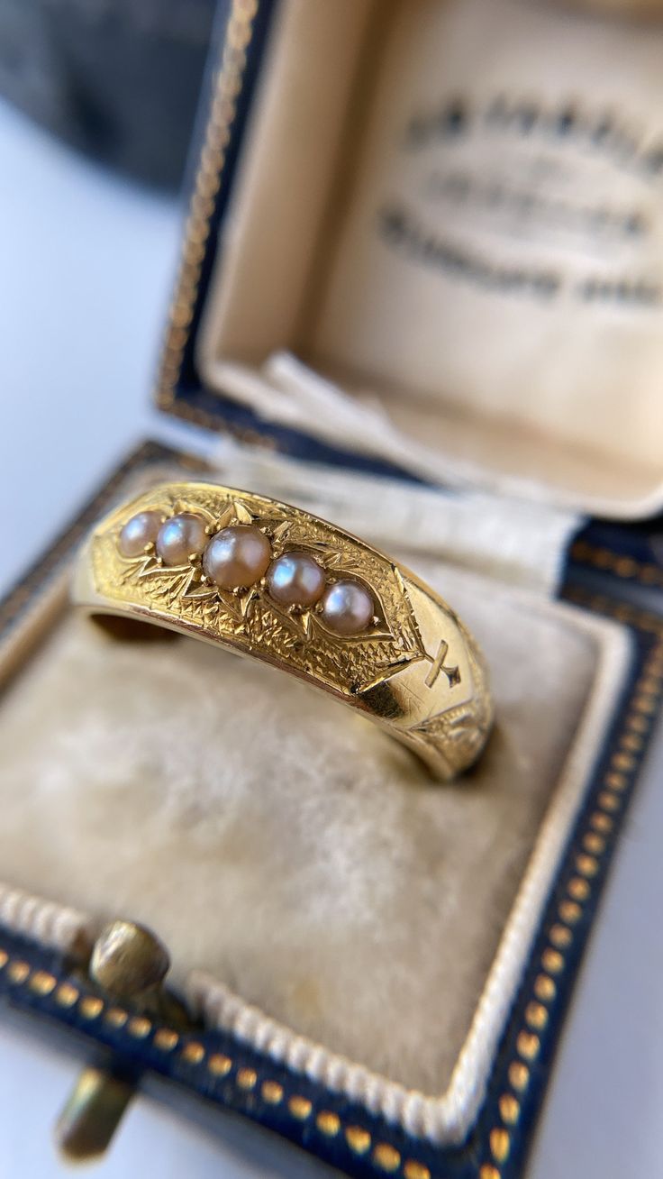 Hand on heart, this is one of the most exquisite rings I have ever come across. The most intricate and beautifully made mourning ring, crafted in solid 18ct gold and dating from the Victorian period. The hand carved band has the phrase In Memory Of engraved all around the shank, in intricate scrolled lettering and hand chased details. Featuring five perfect pink creamy grey pearls, set in slightly hammered gold within a leafy curved surround, everything about this ring screams quality and attent Hand On Heart, Victorian Period, Heart Hands, Victorian Rings, Hammered Gold, Perfect Pink, Pearl Grey, Rings Statement, Ring Set