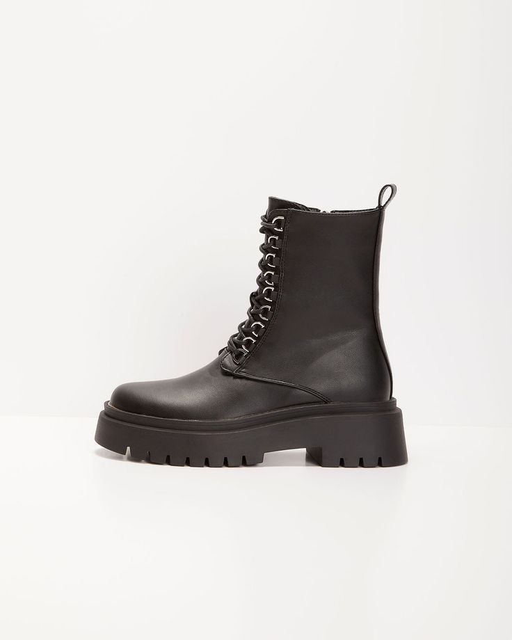 Comfort and style go hand in hand in this utilitarian inspired Frances Side Zip Combat Boots; perfect for the colder seasons or as a statement piece for your next festival or fall event. NOT ELIGIBLE FOR DISCOUNT. Heel Height: 1.95 Material: Upper: 100% PU Lining:100% Polyester Outsole: Thermoplastic PU Utilitarian Ankle Boot Chunky Rubber Sole Hook Style Laces Inner Side Zipper Closure Silver Hardware Closed Round Toe Fall Combat Boots With Round Toe For Concerts, Edgy High Ankle Lace-up Boots For Outdoor, Edgy Platform Boots For Fall Outdoor, Fall Concert Platform Ankle Boots, Fall Concert Ankle Platform Boots, Fall High-top Combat Boots For Concerts, Winter Concert High Ankle Platform Boots, Edgy High Ankle Combat Boots For Winter, Fall Punk High-top Combat Boots