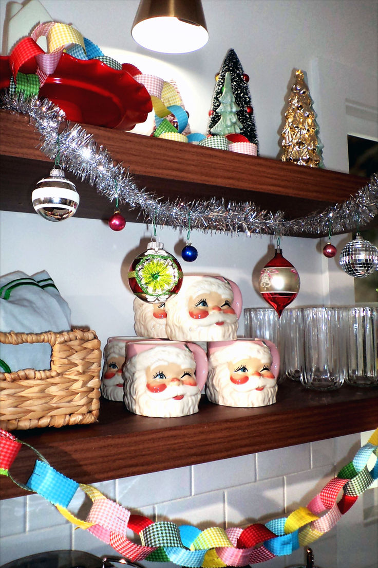 christmas decorations on shelves in a kitchen