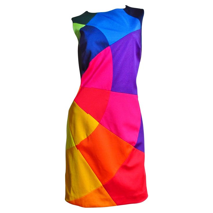 A fabulous colorful dress with a bit of stretch from Moschino. It is is sleeveless with a crew neck and incredible brightly colored shapes each individually sewn together comprising the front of the dress, the back is solid black. It is lined in black and has a back zipper. Fits sizes Medium. Bust 38" Waist 32" Hips 40" Length 37" Chic Evening Dress, Moschino Dress, Color Blocking Outfits, Stretch Mini Dress, Red Sleeveless Dress, Color Block Dress, Moschino Cheap And Chic, Dress Closet, Sleeveless Short Dress