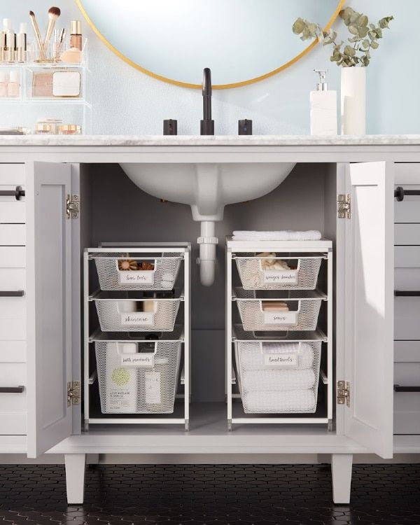 a bathroom sink with two bins under the faucet