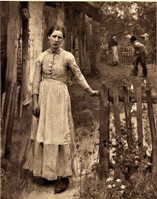 an old black and white photo of a woman standing next to a fence