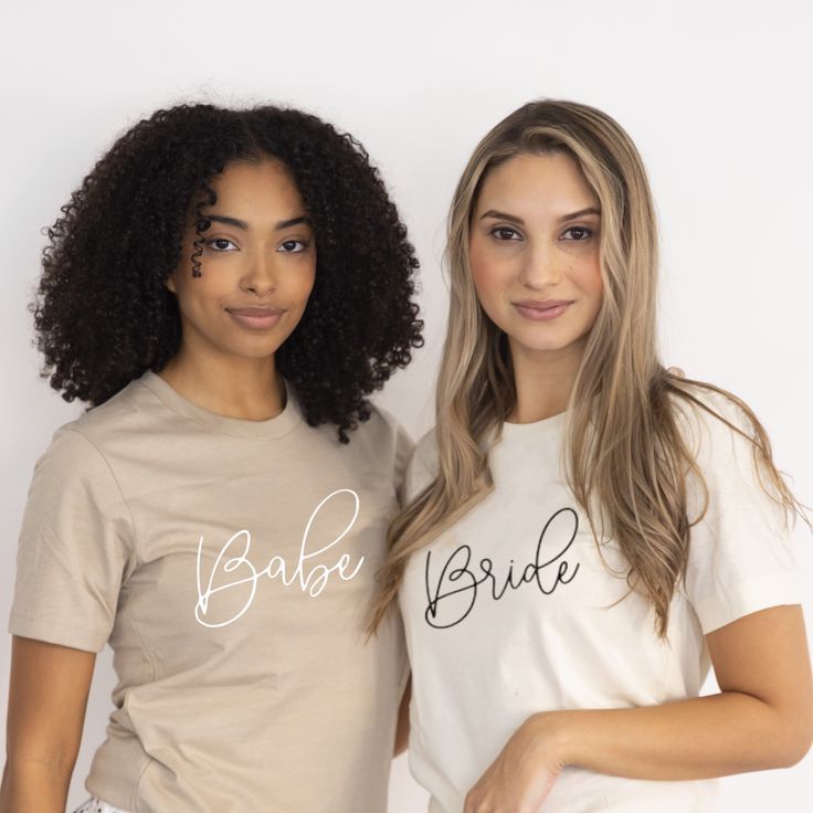 Bride & Babe Shirts - Semi-Fitted Semi-fitted bride & babe shirts make perfect gifts for the bride-to-be, bridesmaids, or even friends! Every bridal squad will love wearing these matching shirts for pictures! Each soft cotton jersey shirt has a crew neck with short sleeves and comes with the text style of your choice. NO RETURNS OR EXCHANGES ON SHIRTS/CLOTHING ITEMS. Size/Color Chart Sizing: Shirts are a women’s semi-fited style (if you want to tie a knot order a size up) Material: Natural: 100% Fitted Short Sleeve Top For Wedding, Custom Text Short Sleeve Tops For Wedding, Short Sleeve Tops For Bridesmaids, White Fitted T-shirt For Bachelorette Party, White Short Sleeve Bride T-shirt, Bride's White Short Sleeve T-shirt, White Short Sleeve Top For Bridesmaids, White Crew Neck Top For Bridesmaids, Fitted White Top For Bridesmaid