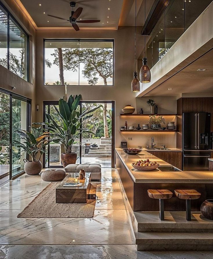 a living room filled with furniture and lots of windows